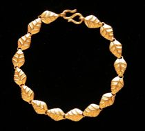 Appraisal: A K Gold Bracelet Small leaves linked together for an