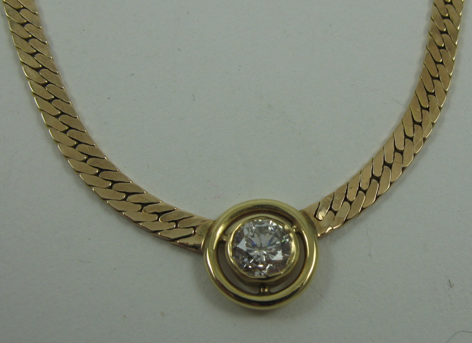 Appraisal: DIAMOND SOLITAIRE NECKLACE K yellow gold round pendant setting and