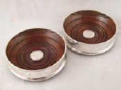 Appraisal: A pair of silver wine decanter coasters London