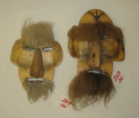 Appraisal: TWO INNUIT BONE AND WOOD FACE MASKS hand carved with