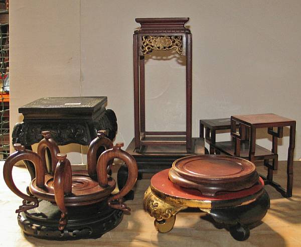 Appraisal: A group of eleven large wood display stands In various