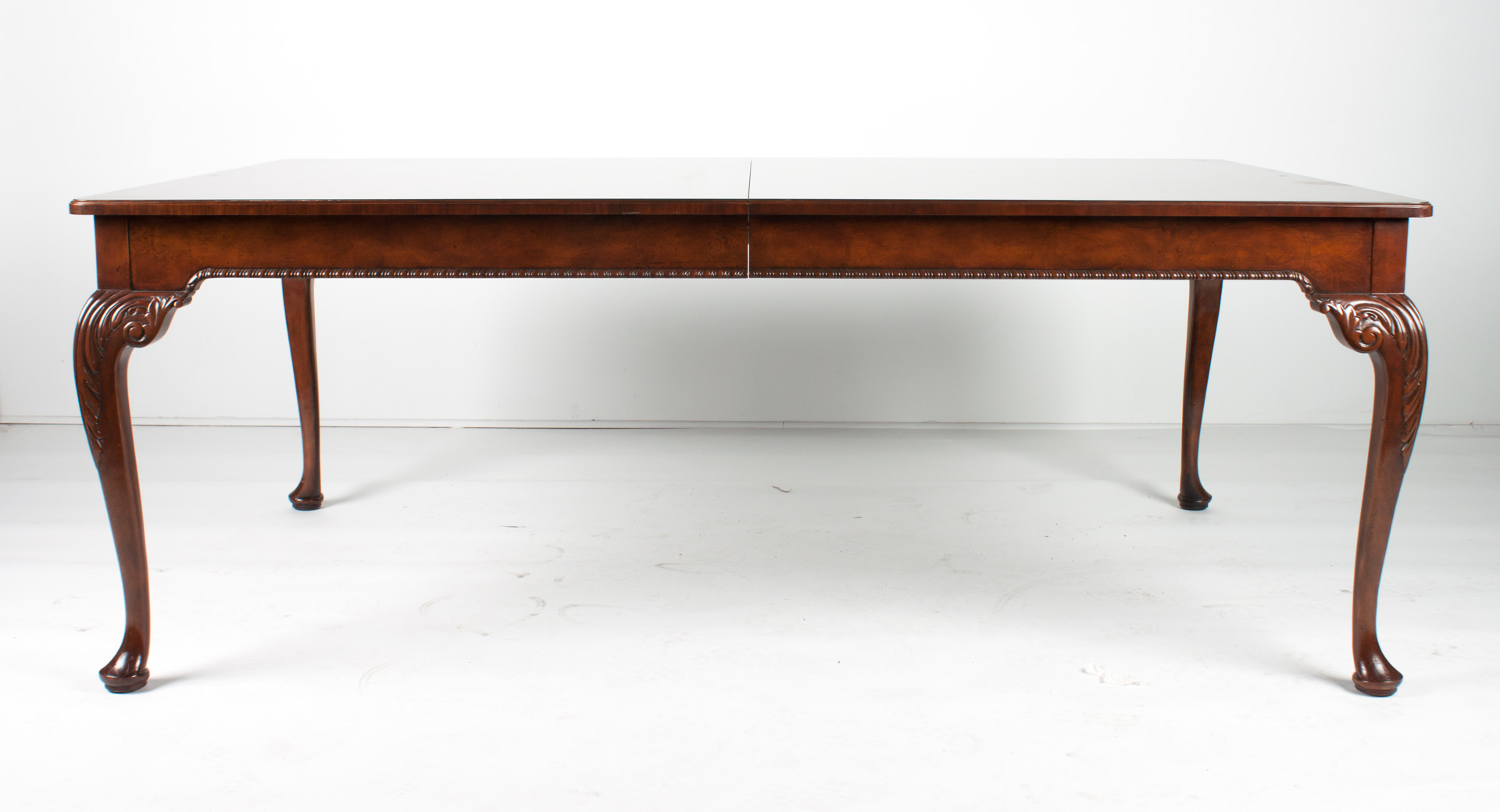 Appraisal: Baker Queen Anne style walnut dining table from the Stately