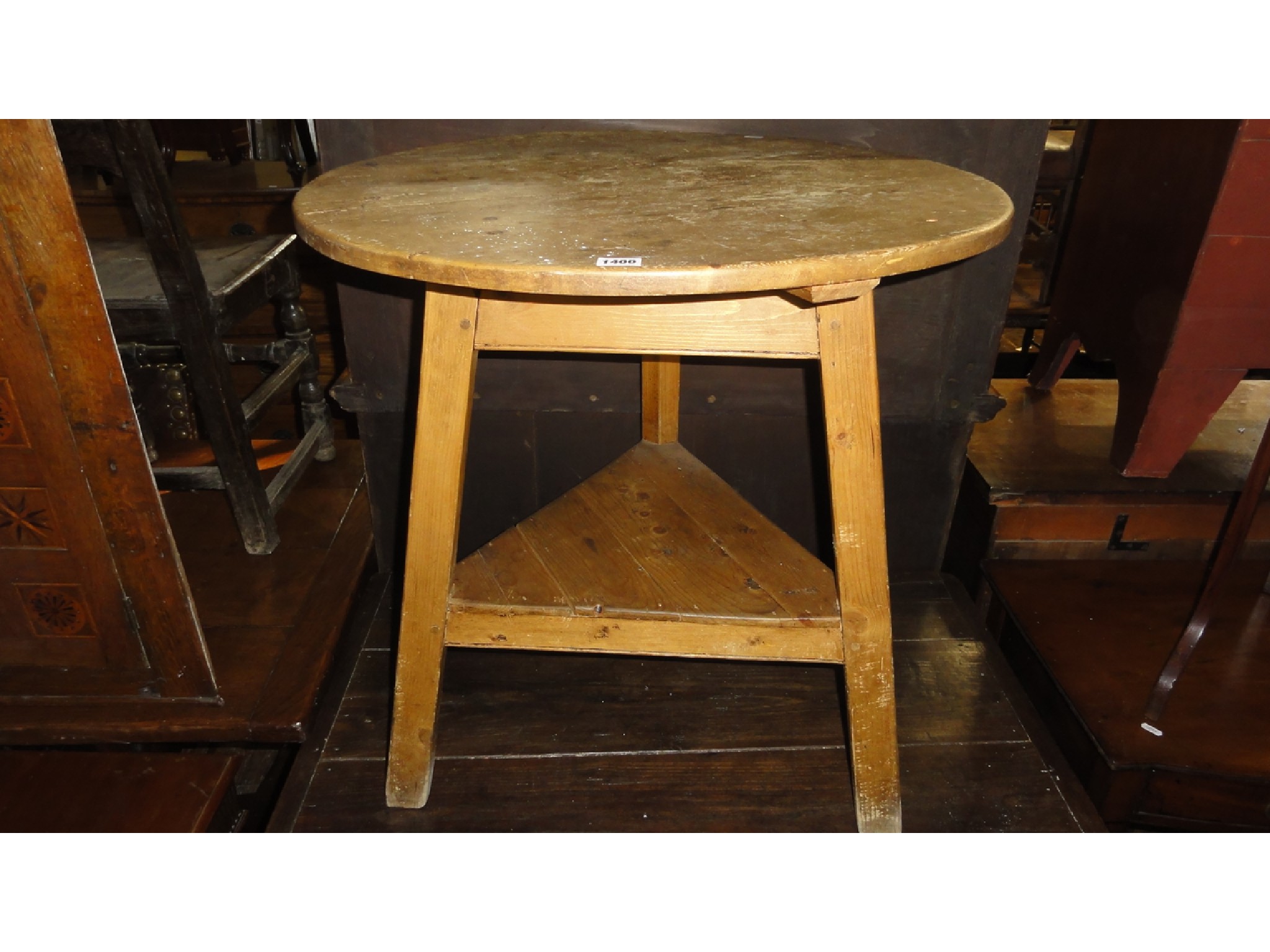 Appraisal: A pine cricket table of usual form the circular top