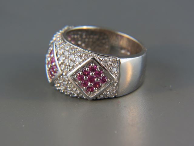 Appraisal: Ruby and Diamond Ring pinkish red round rubies totaling carat