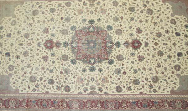 Appraisal: PERSIAN STYLE Wool carpet in tones of cream and rose