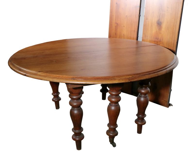 Appraisal: DINING TABLE th century solid walnut ' diameter two part