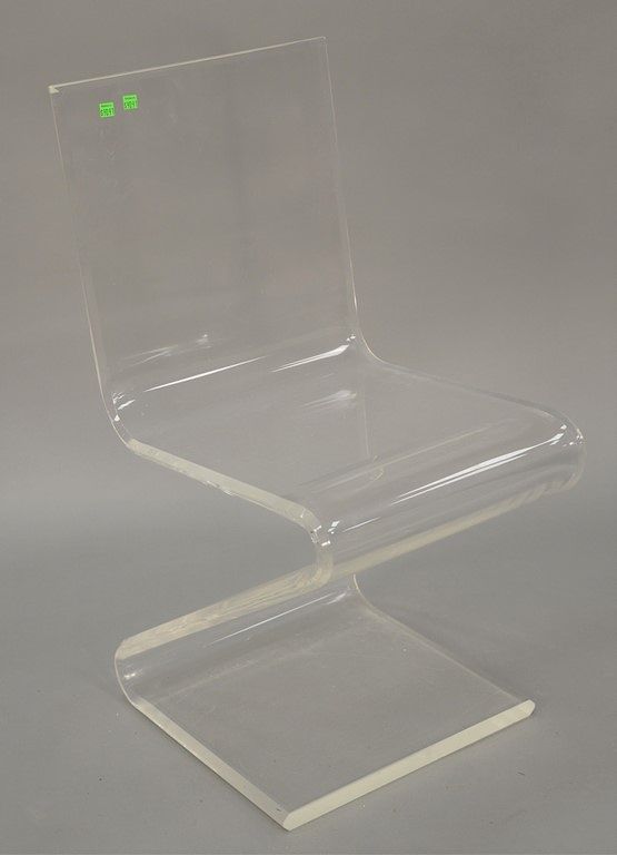 Appraisal: Lucite Z form dining side chair and ladder style curio