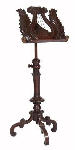 Appraisal: A VICTORIAN MAHOGANY MUSIC STAND with lyre and leaf height