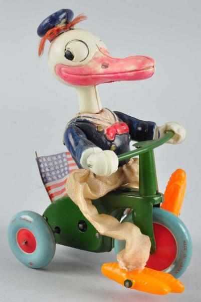 Appraisal: Celluloid Disney Donald Duck Tricycle Wind-Up Toy Description Japanese Circa