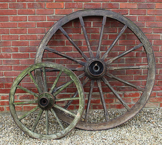 Appraisal: A LARGE SIXTEEN SPOKE CARTWHEEL approximately cm in diameter together