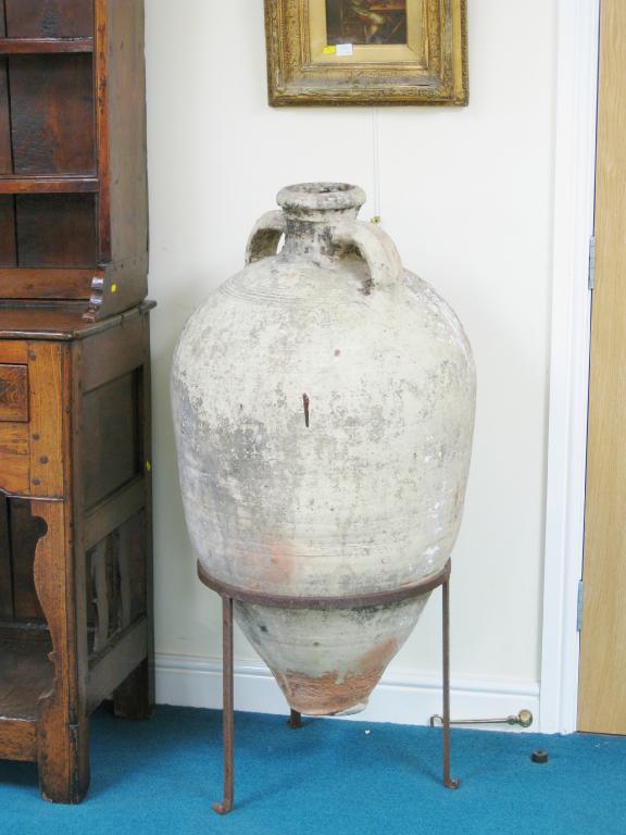 Appraisal: A large terracotta two handled Olive Jar with cream covering