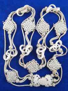 Appraisal: A Chinese necklace comprising a cord tied with endless knots