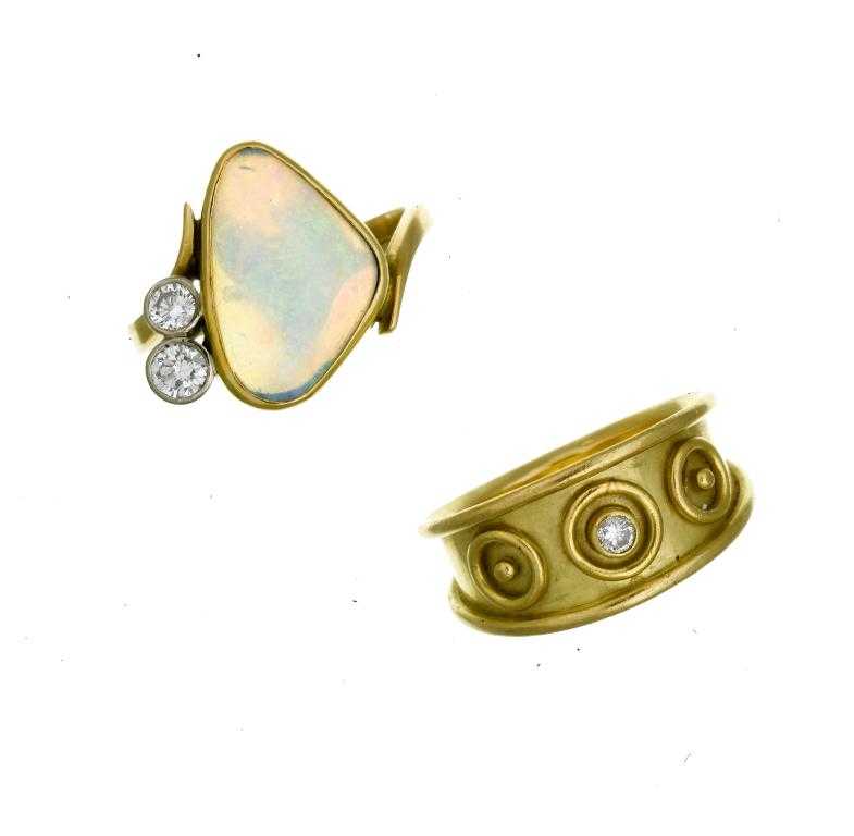 Appraisal: AN OPAL AND DIAMOND RING the irregular opal cabochon set