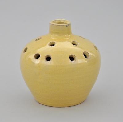 Appraisal: A Yellow Glaze Pottery Vase Bulbous tapered form with a