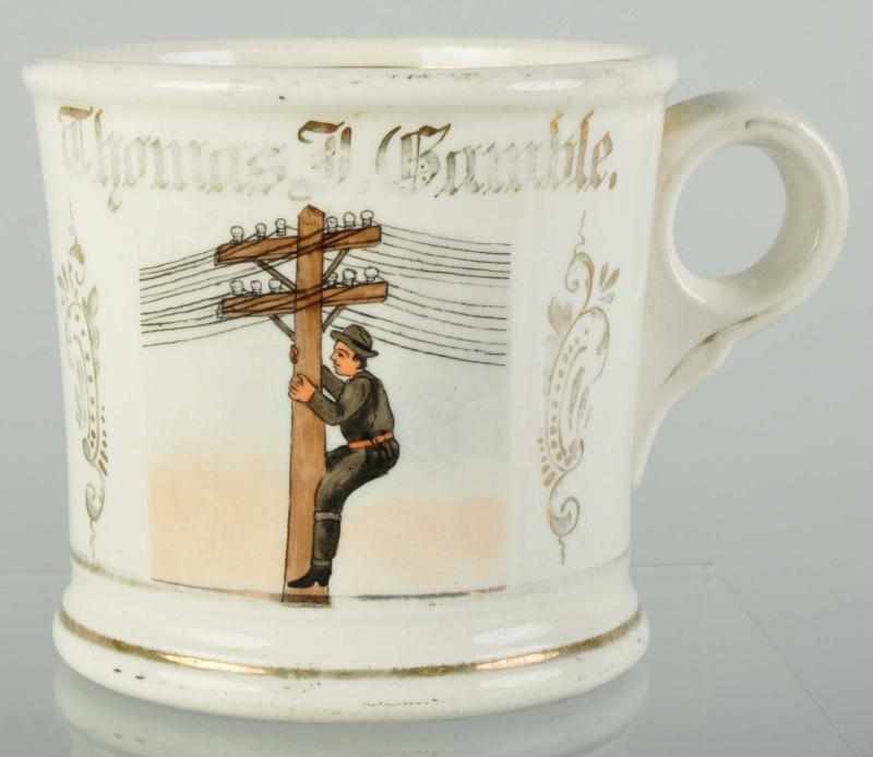 Appraisal: Lineman Climbing Pole Shaving Mug Description Guilt name Thomas F