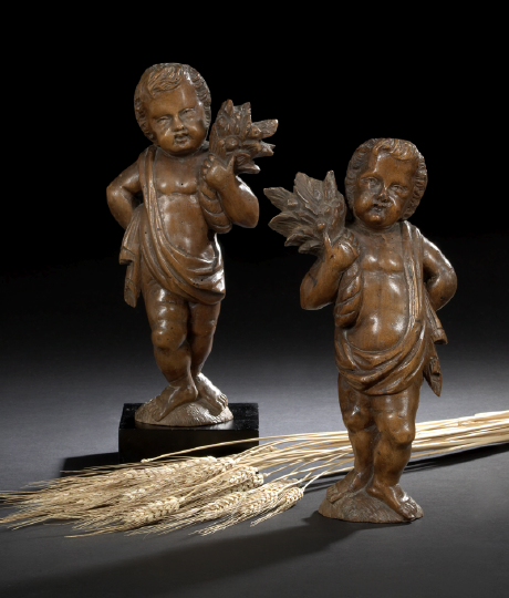 Appraisal: Pair of German Carved Lindenwood Flat-Back Figures of Putti Allegorical