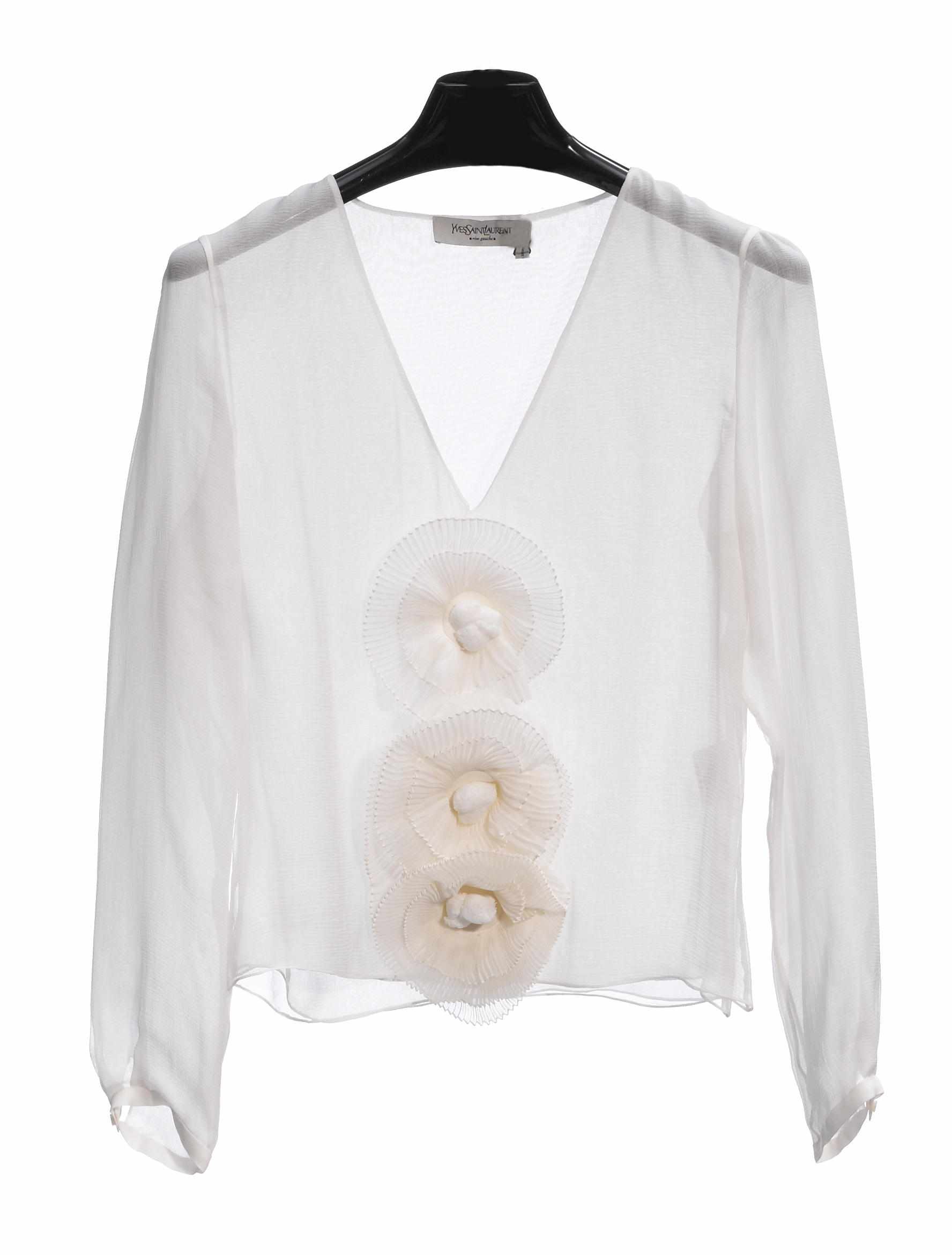 Appraisal: An Yves St Laurent sheer white silk blouse with a