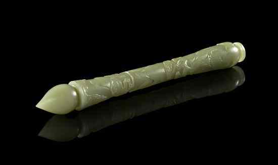 Appraisal: A Chinese Carved Jade Brush Handle of celadon colored jade