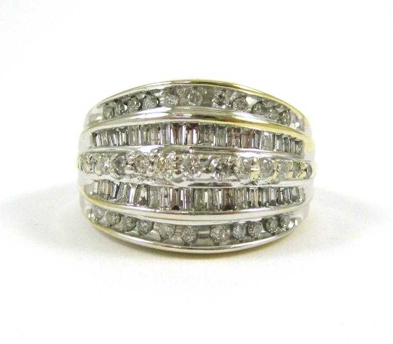 Appraisal: DIAMOND AND TEN KARAT WHITE GOLD RING The wide white