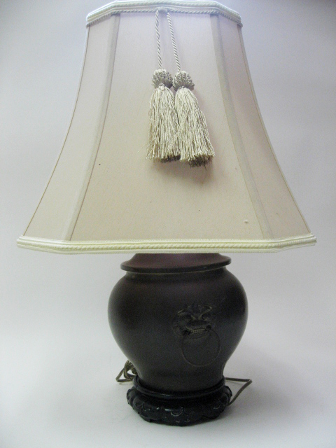 Appraisal: An Asian Patinaed Metal Lamp in the form of a