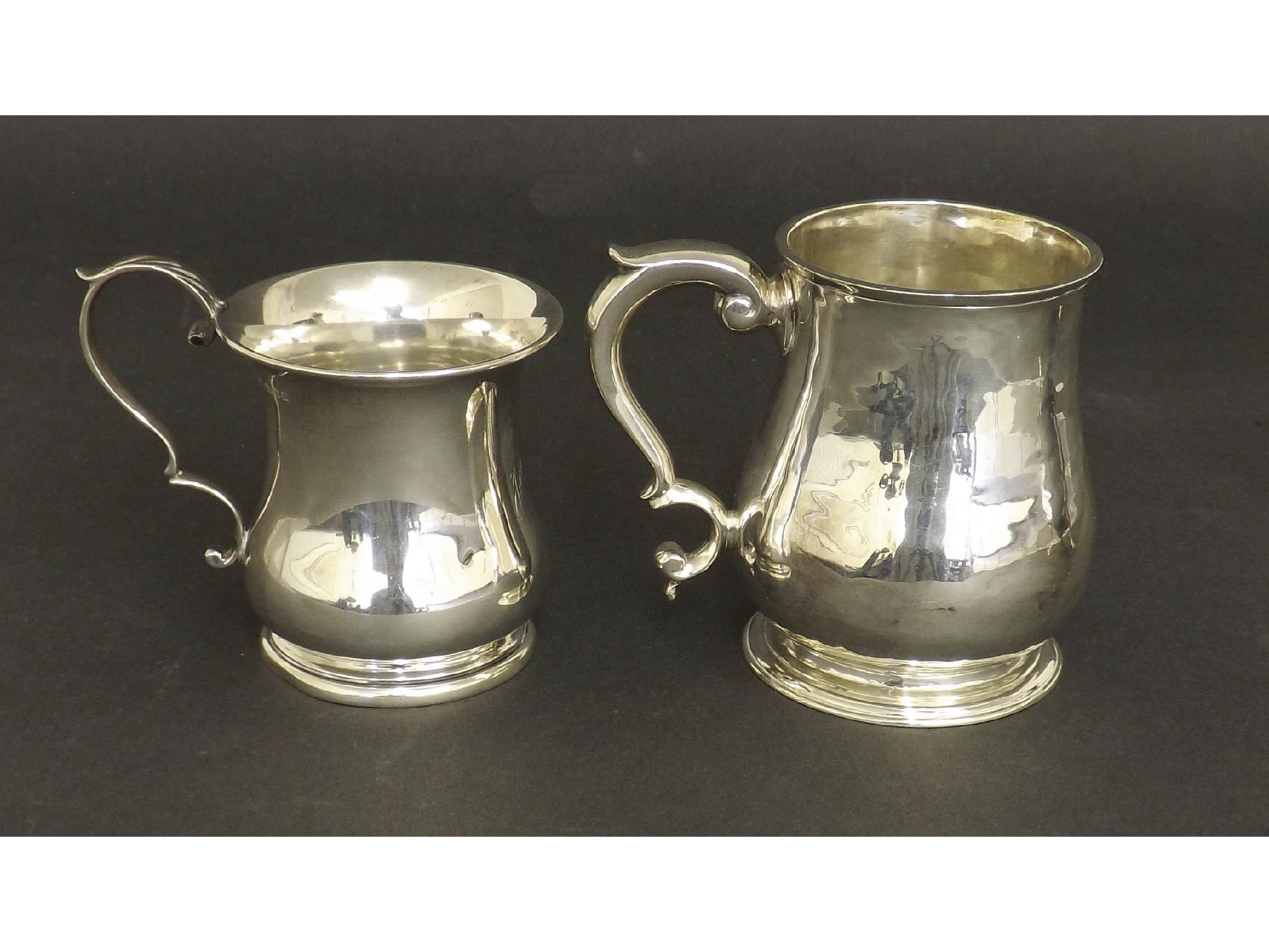 Appraisal: Edwardian silver planished baluster tankard with S-scroll handle maker The