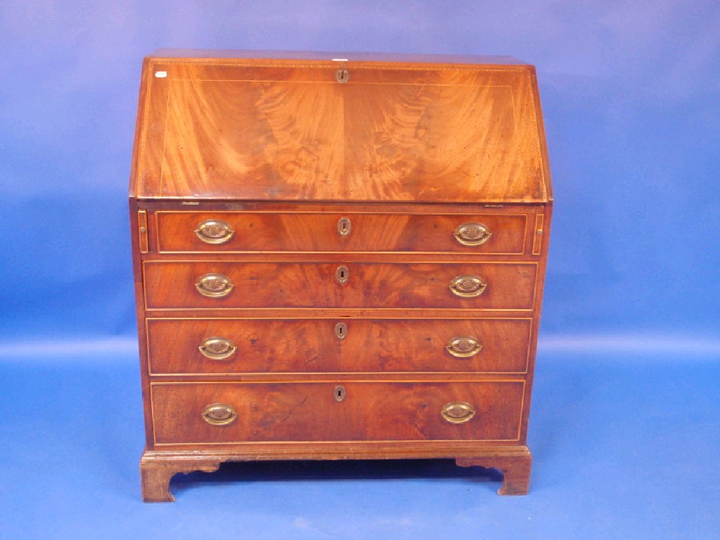 Appraisal: A George III mahogany and flame veneered bureau the chevron