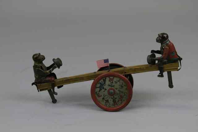 Appraisal: MONKEYS ON SEE SAW TOY Germany lithographed tin key wind