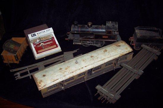 Appraisal: An O gauge steam fired tank engine a carriage other