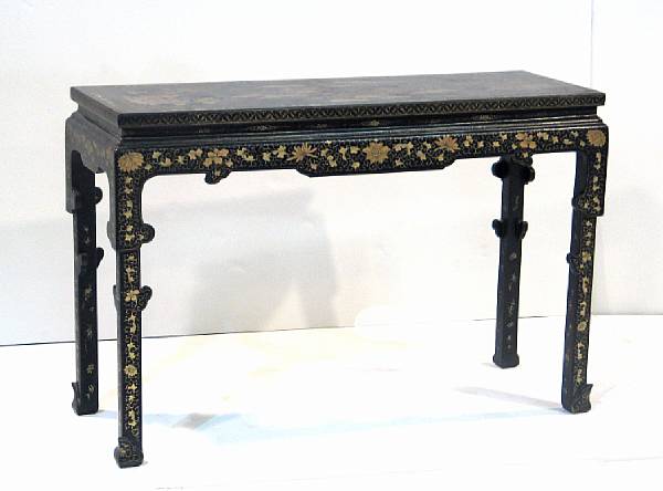 Appraisal: Two lacquered wood tables with gilt decoration The first a