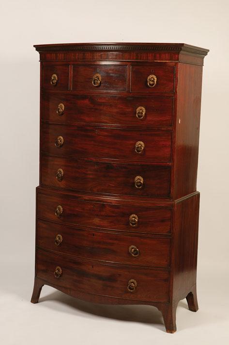 Appraisal: A GEORGE III MAHOGANY BOW FRONT CHEST ON CHEST the