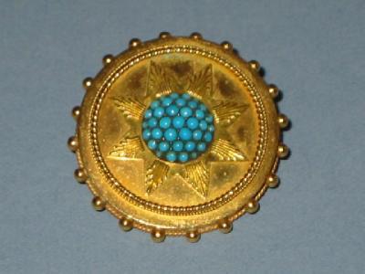 Appraisal: A VICTORIAN TURQUOISE BROOCH of circular form having domed turquoise