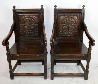 Appraisal: Pair Jacobean carved oak armchairs A pair of Jacobean carved