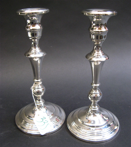 Appraisal: PAIR OF STERLING SILVER CANDLE STICKS having a patented twist