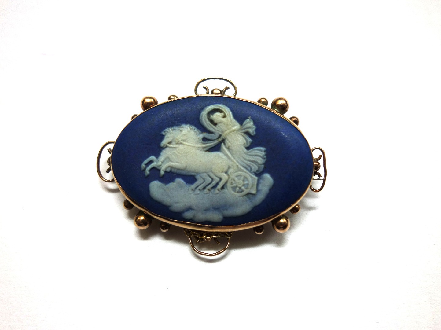 Appraisal: A Victorian gold and oval Wedgwood blue jasper panel brooch