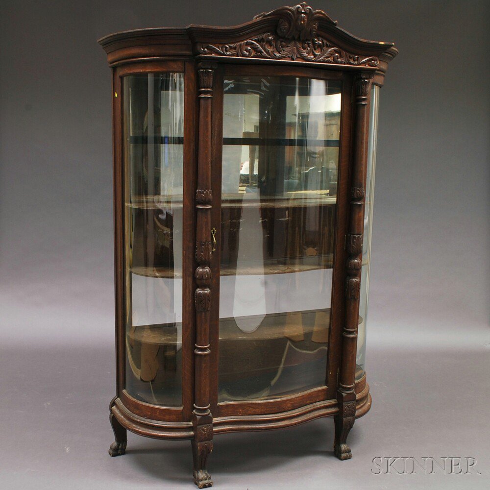 Appraisal: Carved Oak Glazed Display Cabinet th century the cornice-molded crest