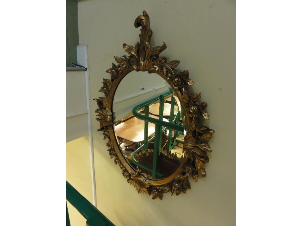 Appraisal: A pair of gilt framed wall mirrors of oval form