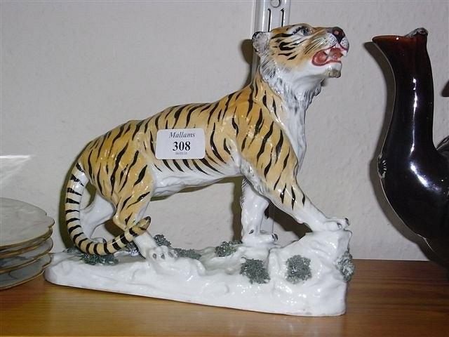 Appraisal: A HOCHST STYLE MODEL of a tiger growling across