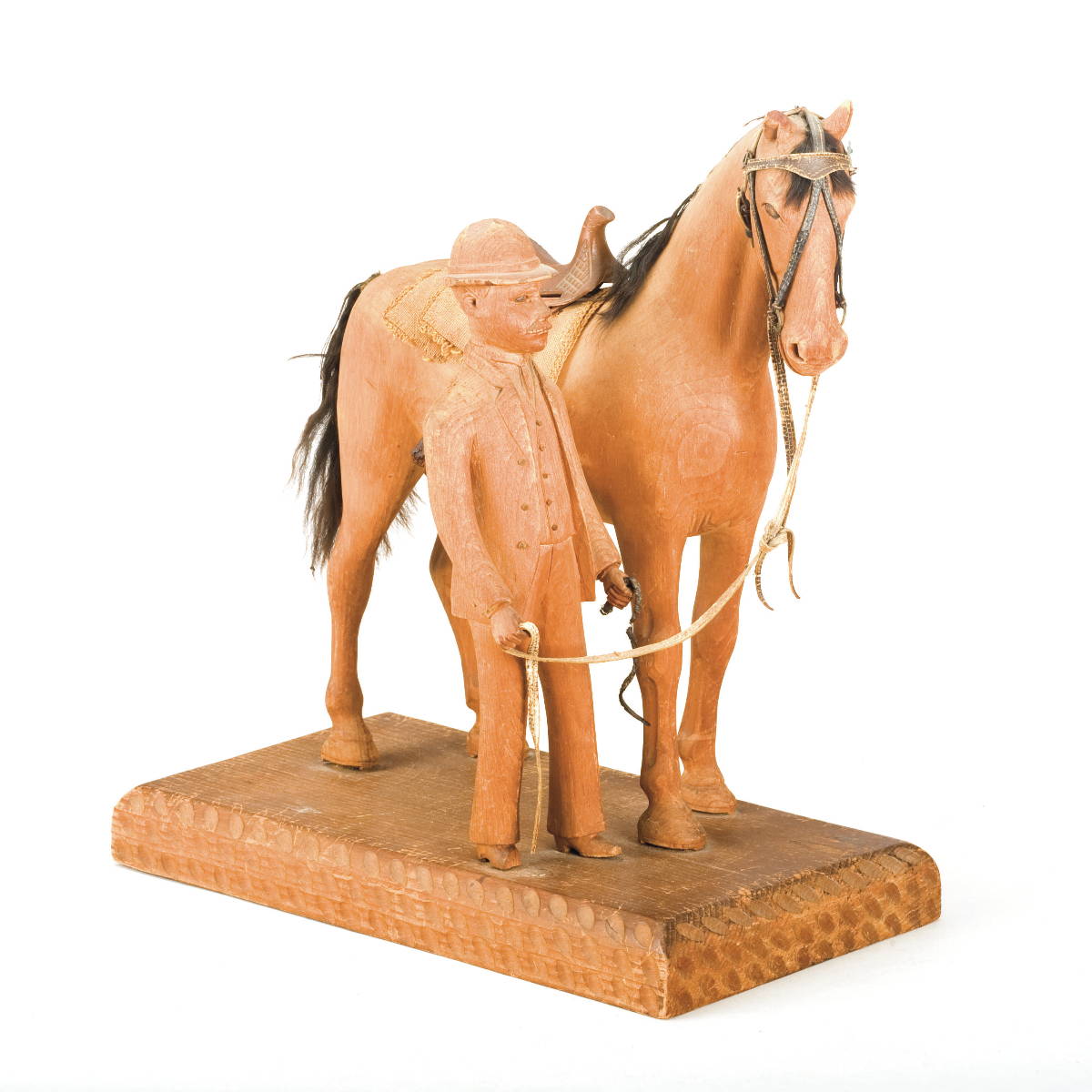 Appraisal: LATE NINETEENTH CENTURY CARVED WOOD HORSE AND MASTER The carved