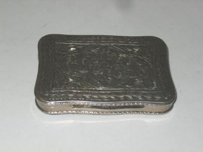 Appraisal: A CONTINENTAL PILL BOX stamped of oblong form chased with