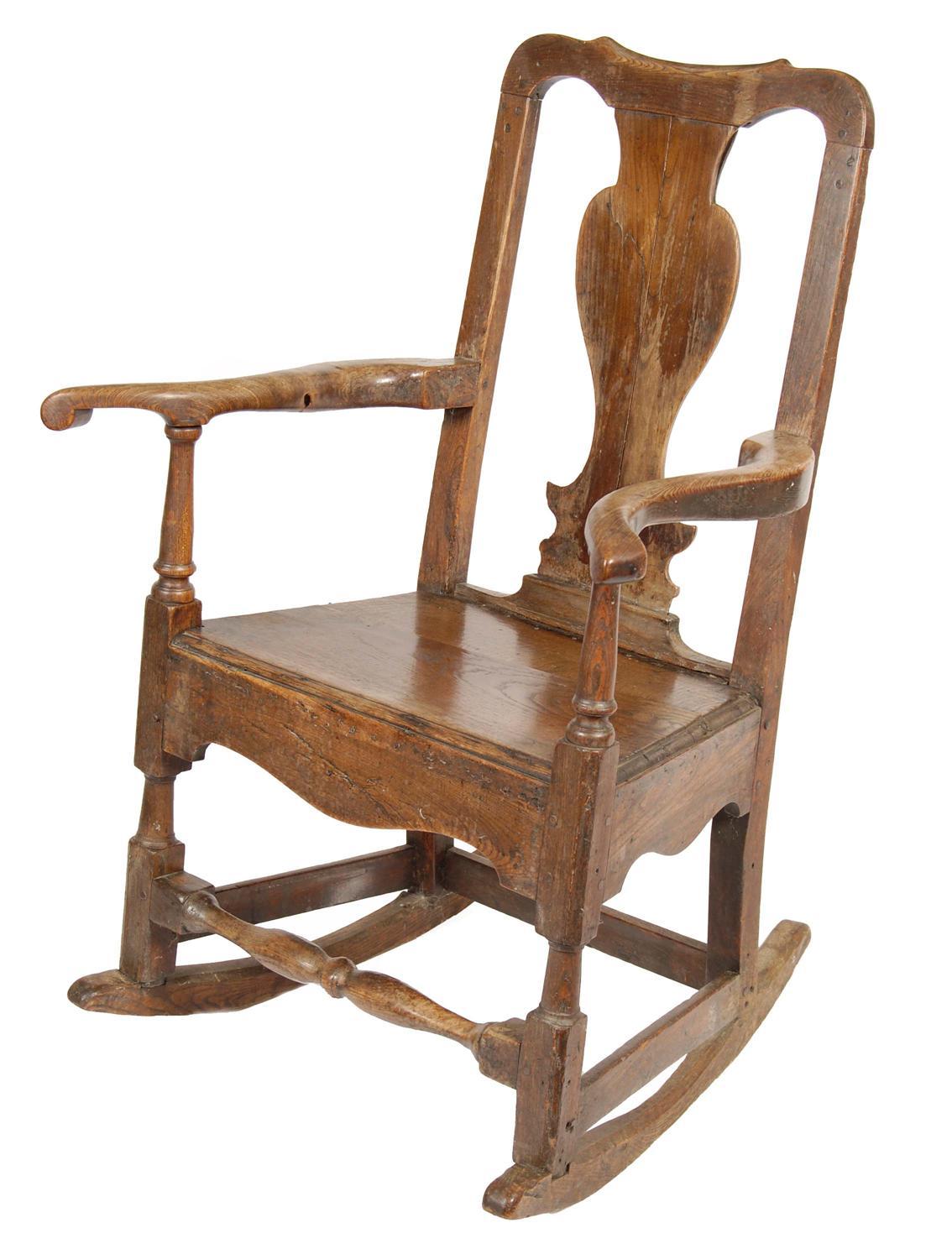 Appraisal: An early th century ash and fruitwood rocking chair