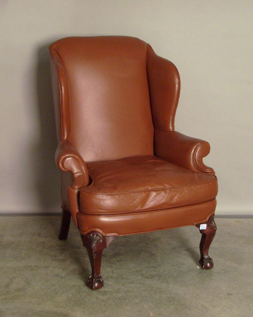 Appraisal: Chippendale wing chair with brown leather upholstery Provenance Collection of