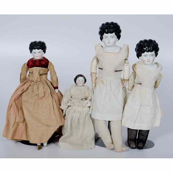 Appraisal: Dolls with Porcelain Heads Collection of four dolls with porcelain