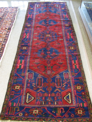 Appraisal: PERSIAN MALAYER RUNNER Northwestern Iran three blue geometric medallions and