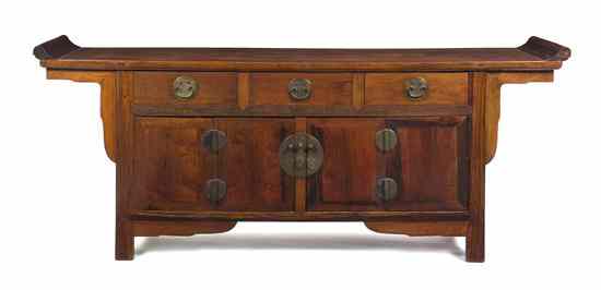 Appraisal: A Chinese Huanghuali Coffer having a rectangular top with upturned