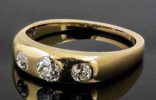 Appraisal: A late Victorian gold coloured metal mounted three stone diamond