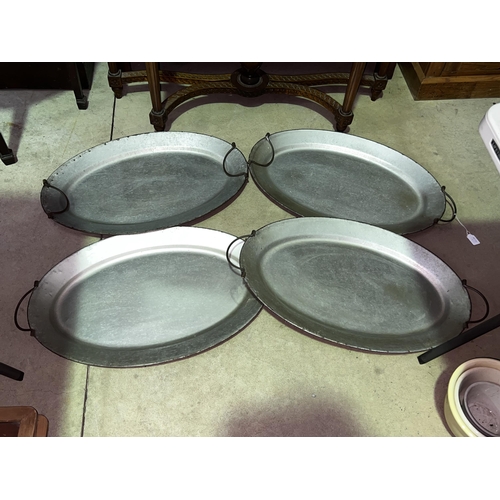 Appraisal: Four oval metal twin handle serving trays approx cm x