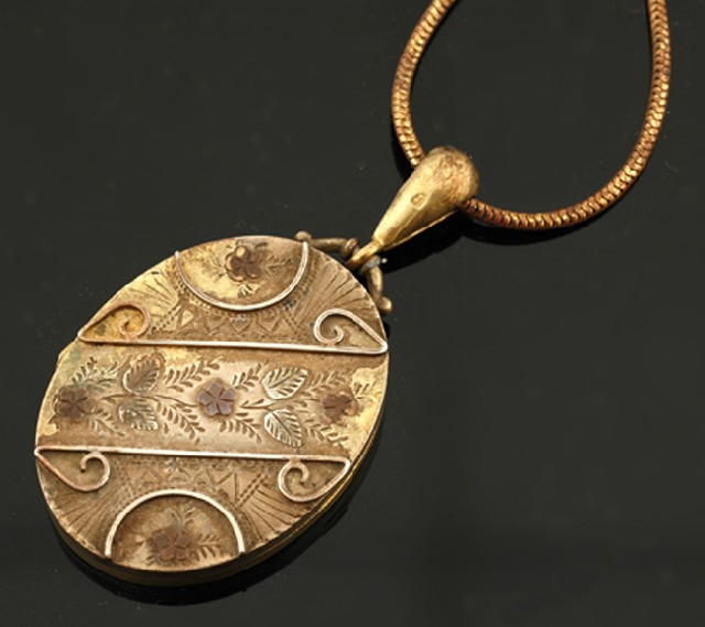 Appraisal: ANTIQUE SILVER GILT LOCKET WITH TWO TONE GOLD INLAY