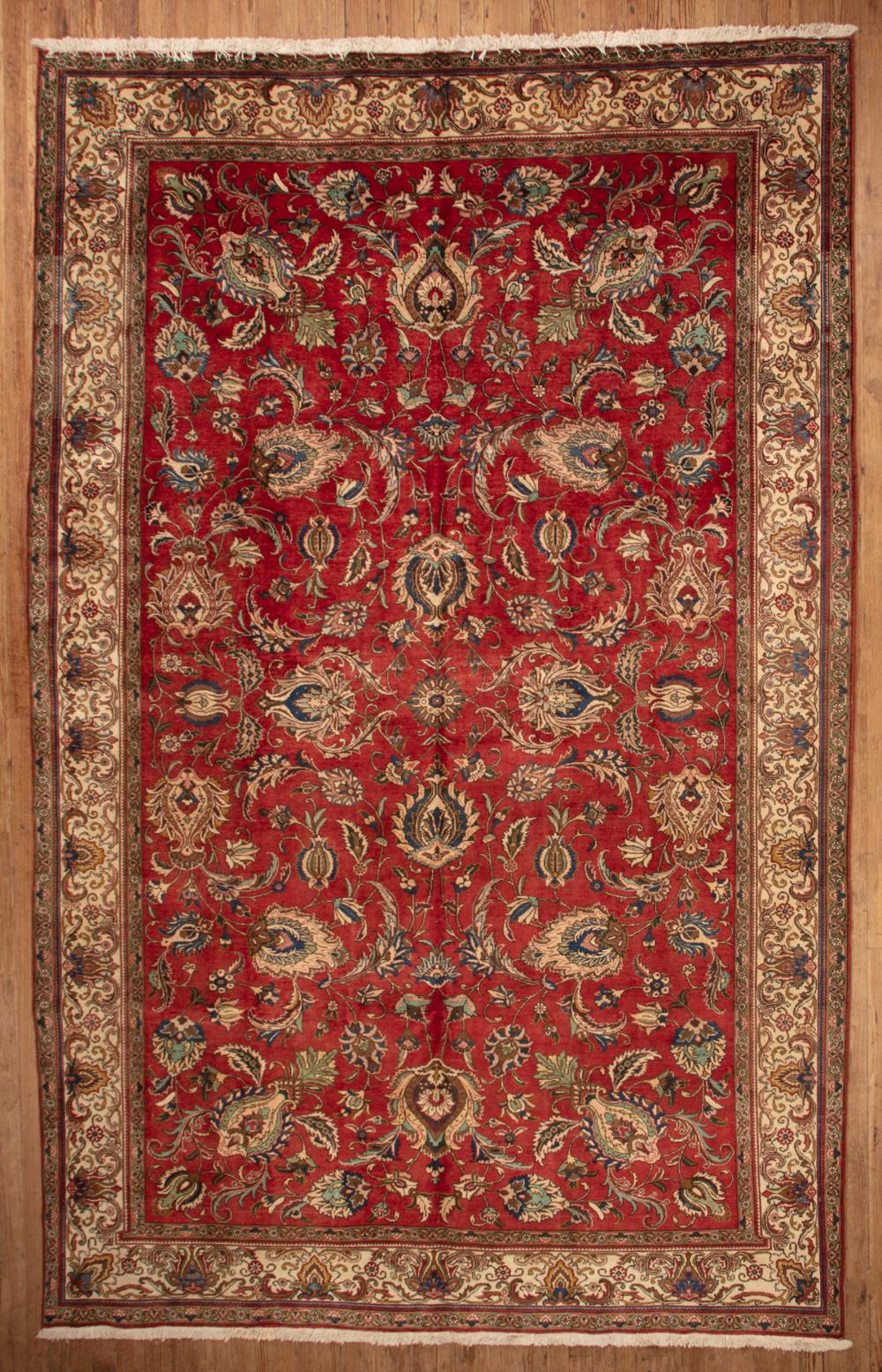 Appraisal: Persian Tabriz Carpet red ground overall floral design ft in