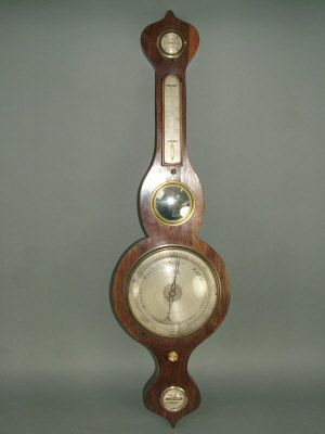 Appraisal: A Victorian rosewood cased wheel barometer with dry damp indicator