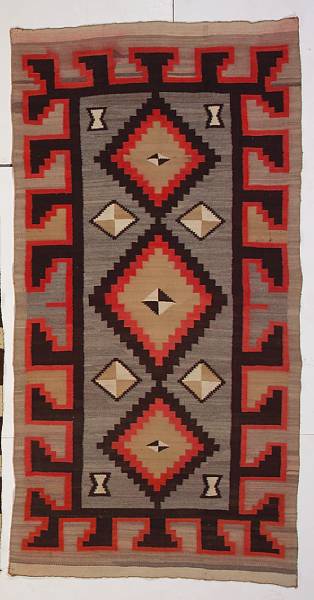 Appraisal: A Navajo rug Centering three conjoined stepped diamonds flanked by